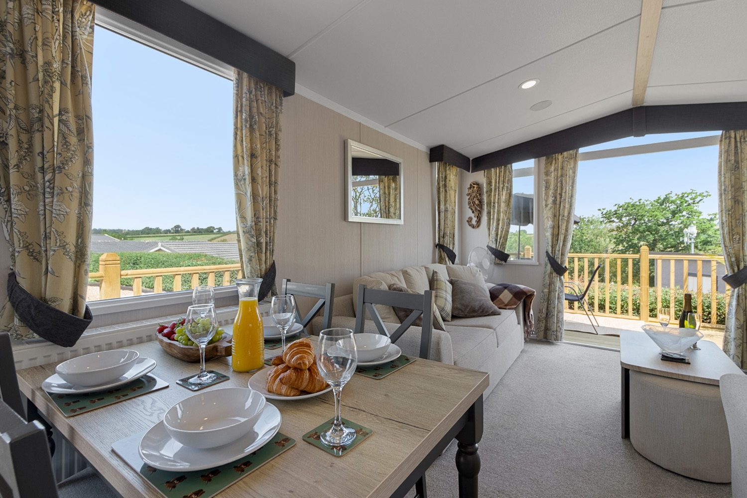 Dining table set for breakfast with a view over the countryside