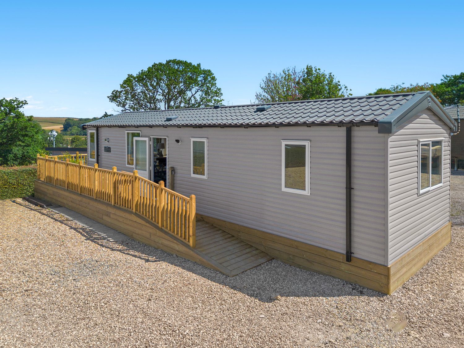 Exterior of Paws & Palms Retreat with decking and access ramp