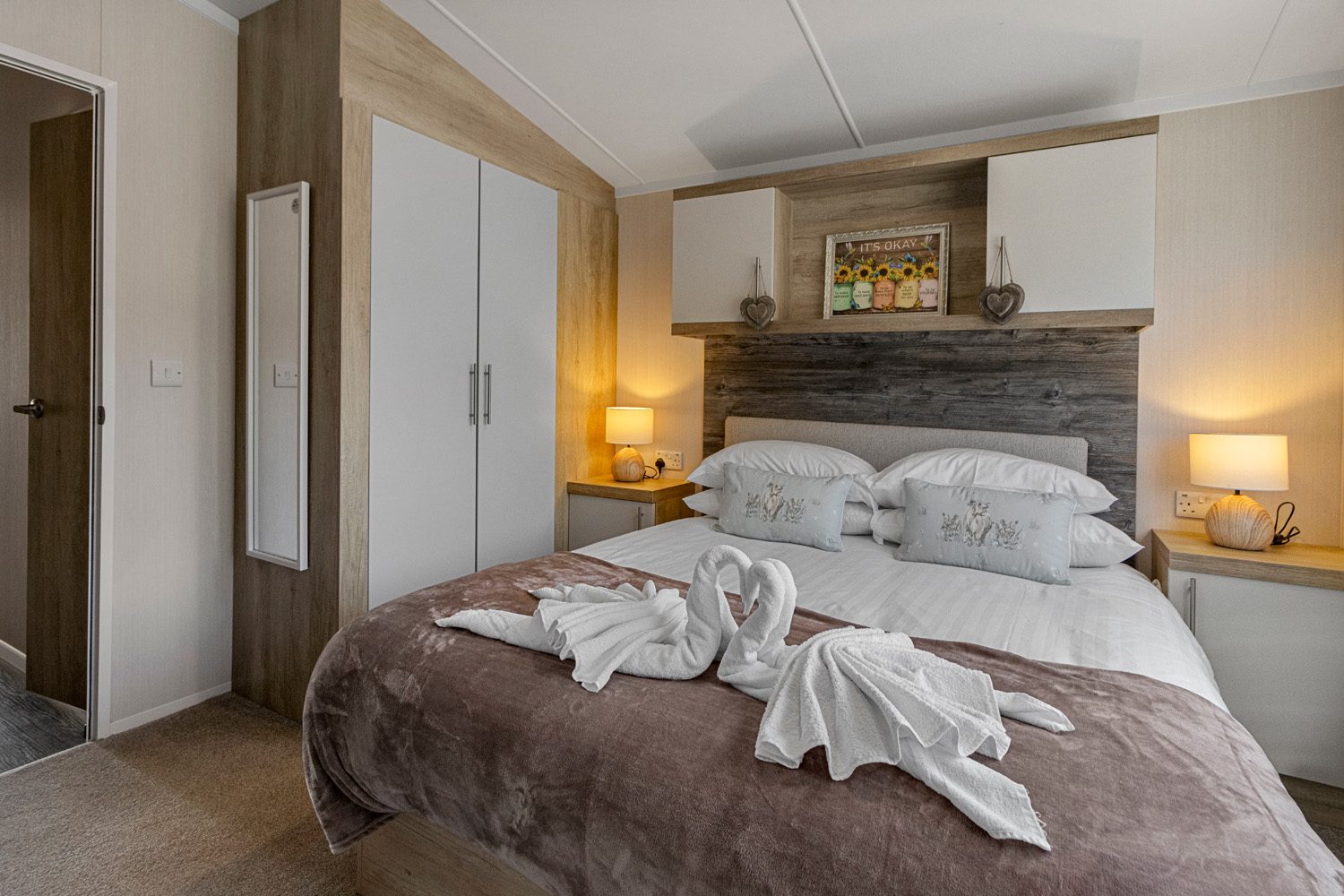 Master bedroom with towel swans on the bed