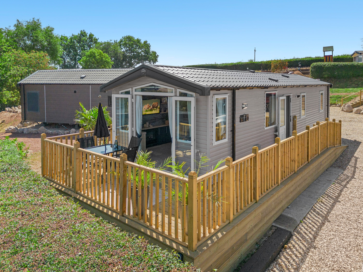 Paws & Palms Retreat static caravan exterior with decking