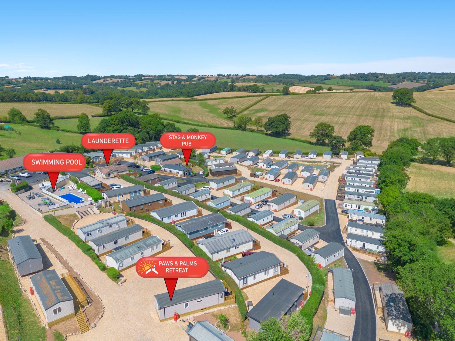 Aerial view of Springfield Retreat with the pool, launderette, pub, and Paws & Palms Retreat marked
